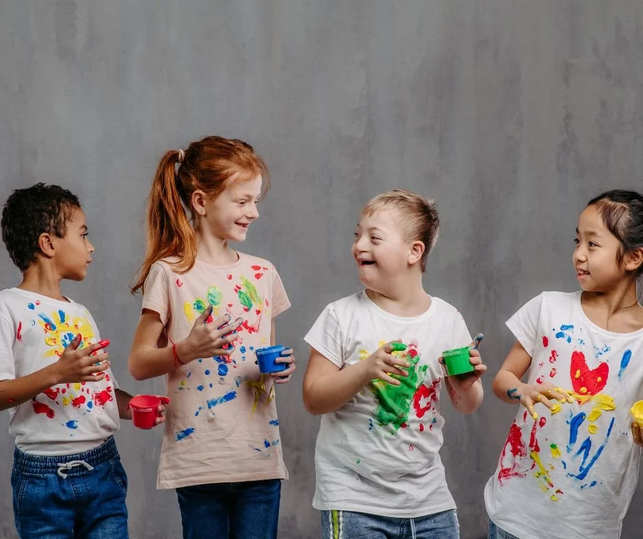 Children with different backgrounds and abilities enjoying a creative learning activity together
