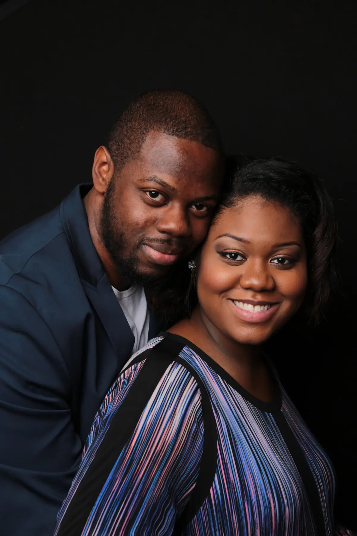 Andrea and Marc Cesar photographed together in a studio portrait