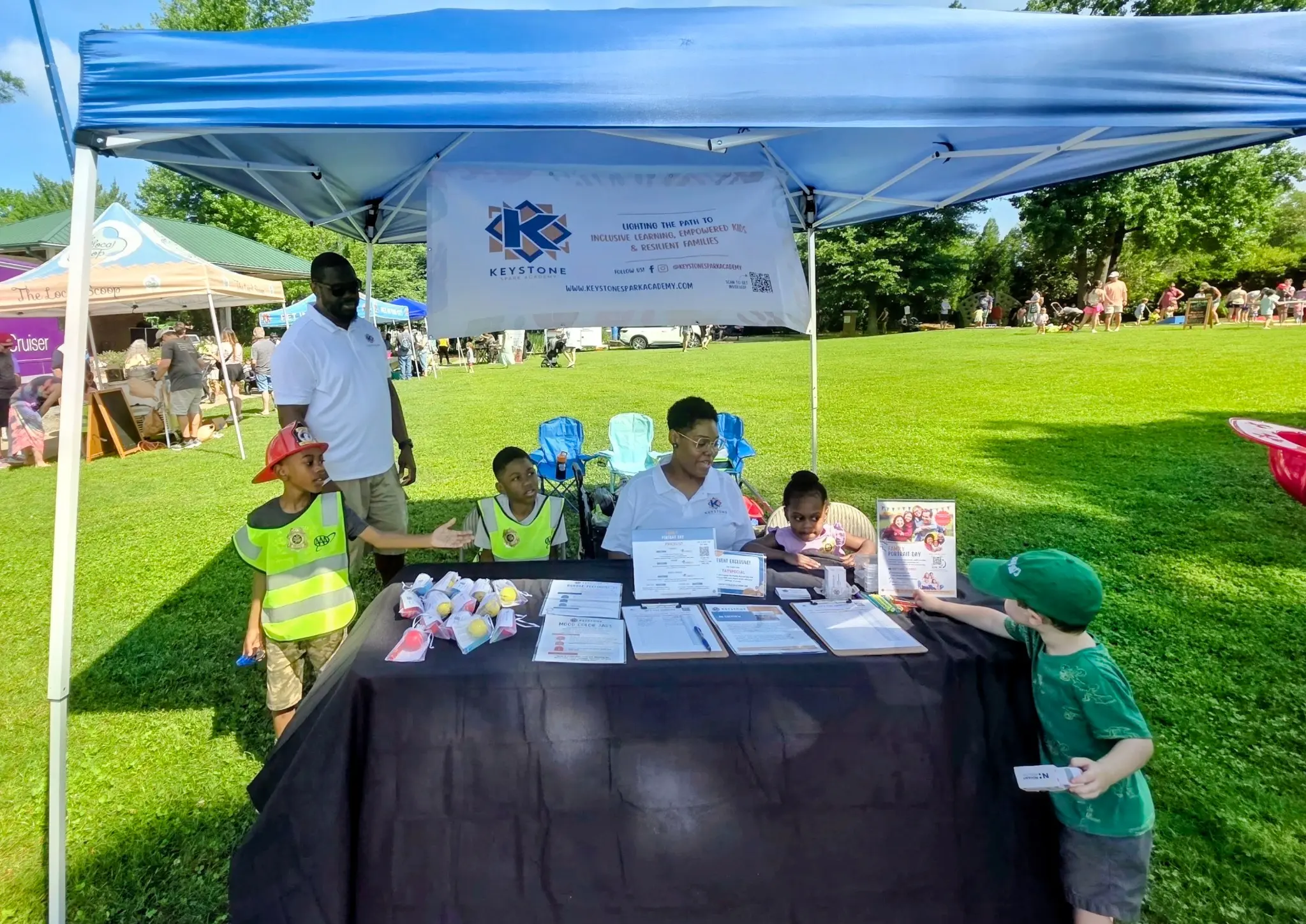 Keystone Spark Academy sharing family activities and resources at an outdoor community event