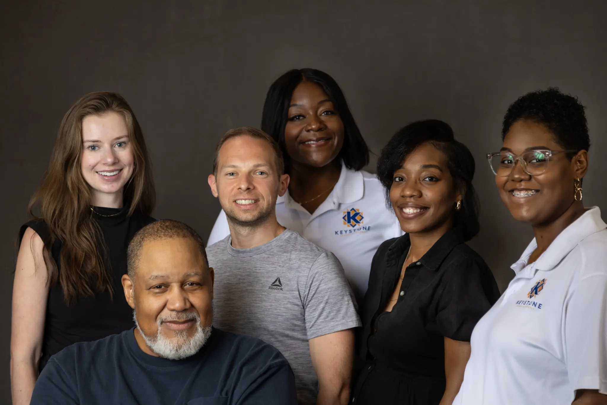 Community members and Keystone Spark Academy representatives gathered for a group portrait