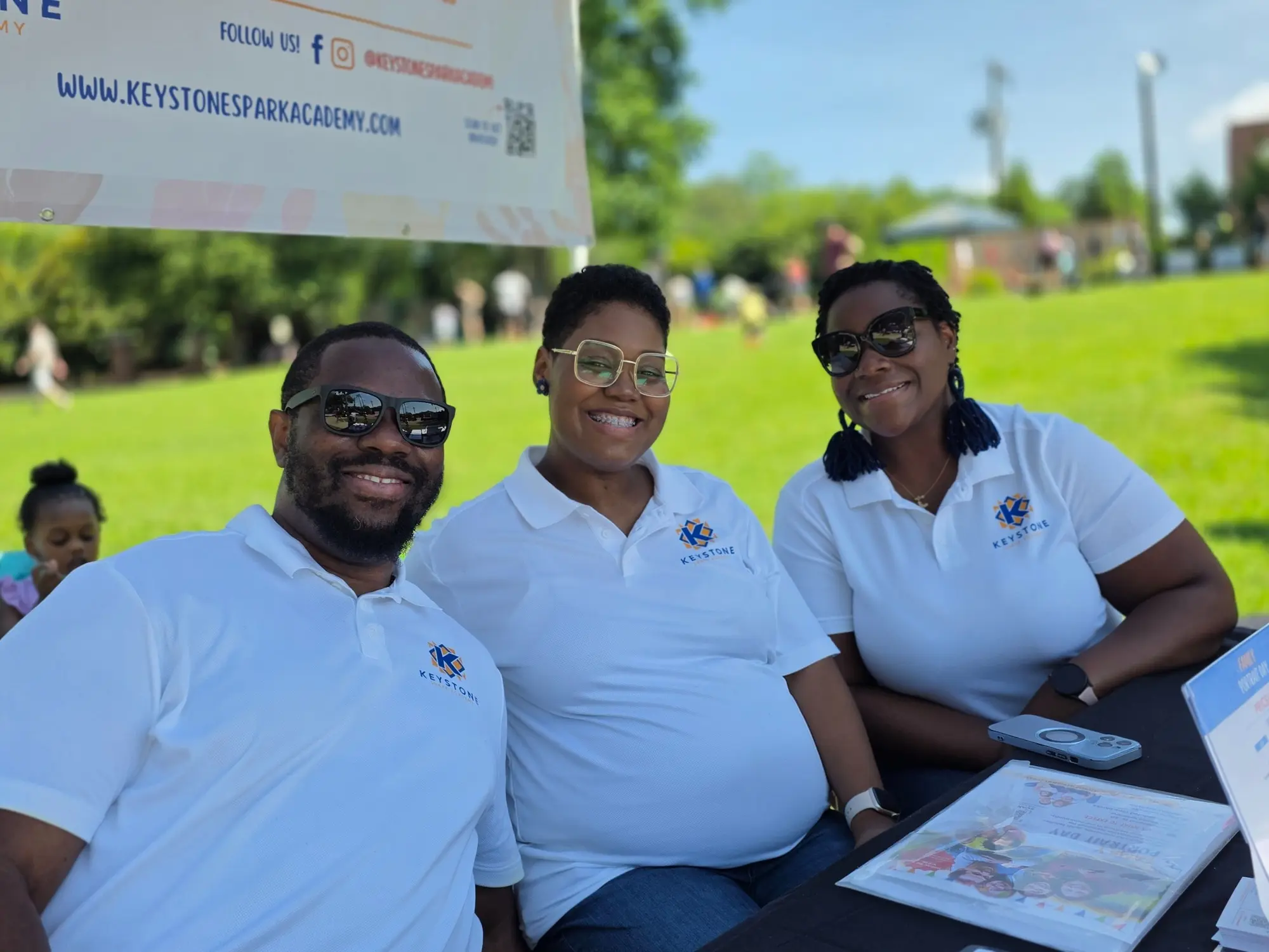 Members of the Keystone Spark Academy team together at an outdoor community event